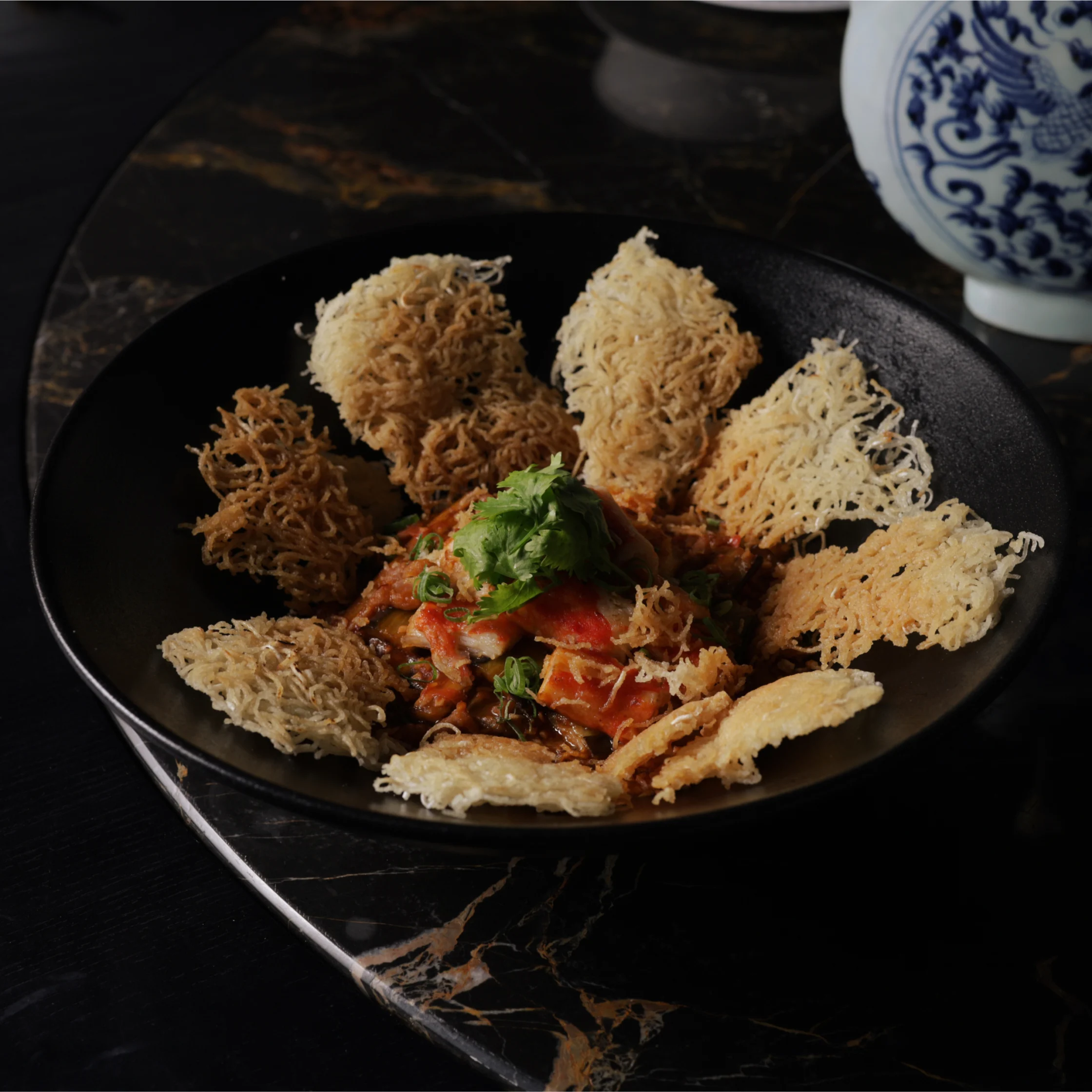 Alaskan Crabmeat and Minced Pork with Roe Chili Sauce and Crispy Rice Noodles