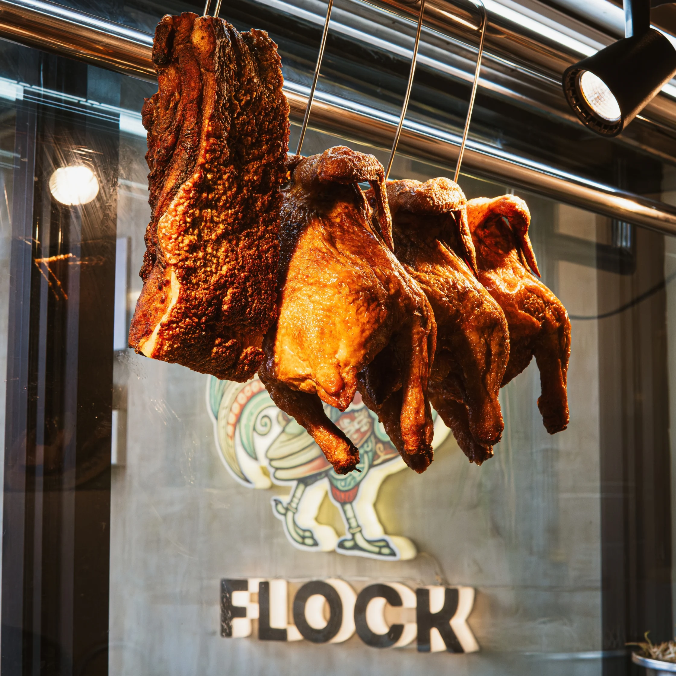 roasted chicken hanging at flock in bf homes
