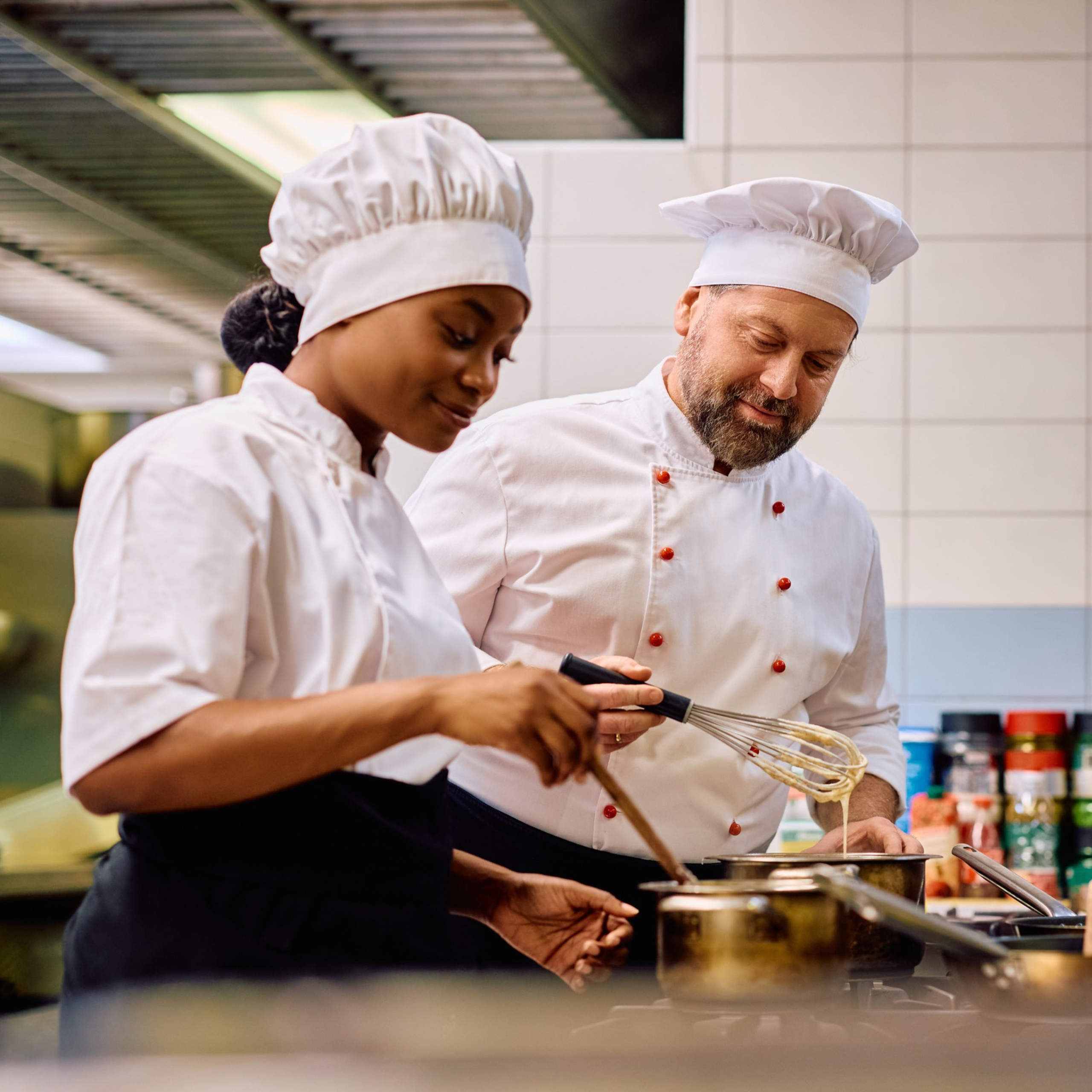 chefs collaborating in kitchen