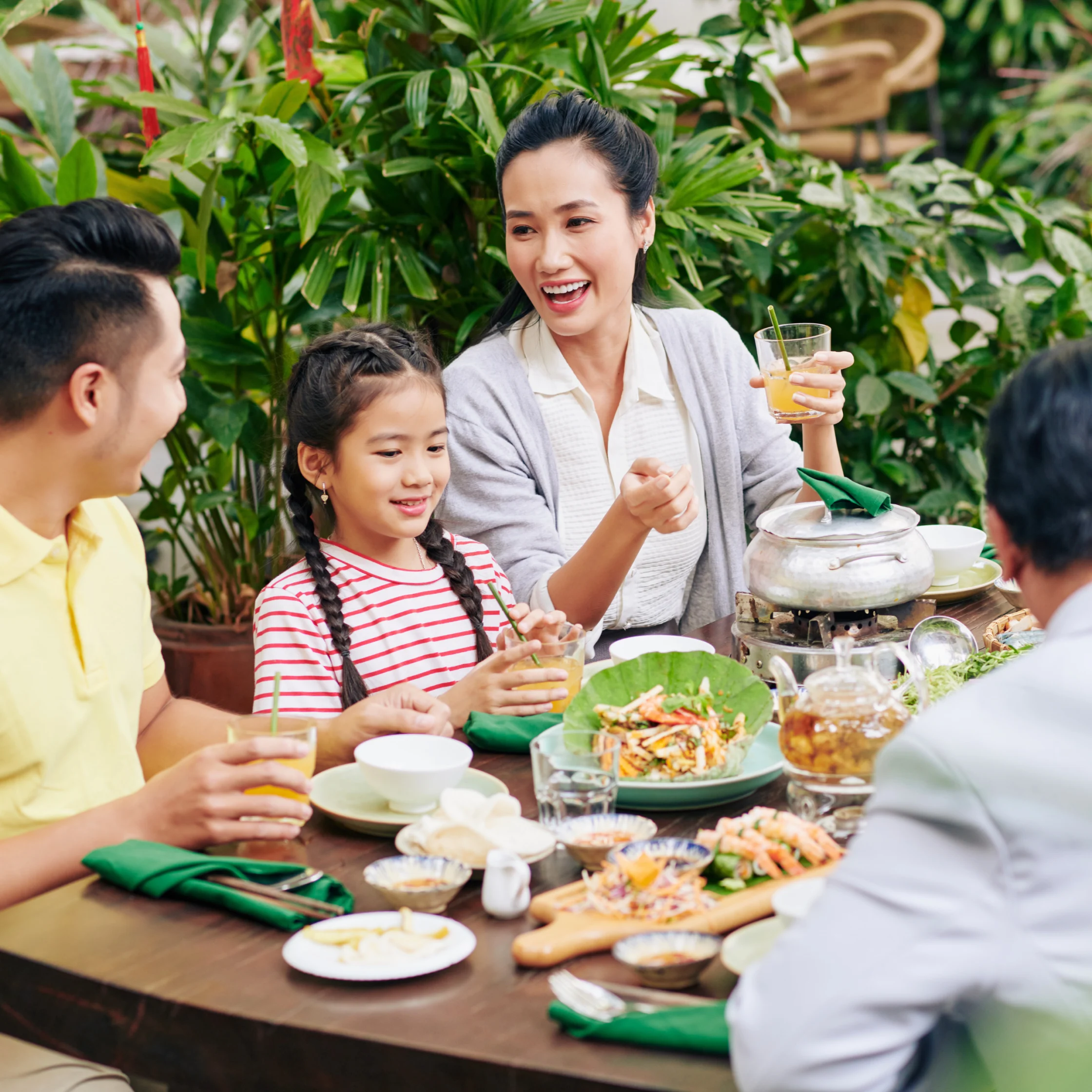 family eating lunch together happily