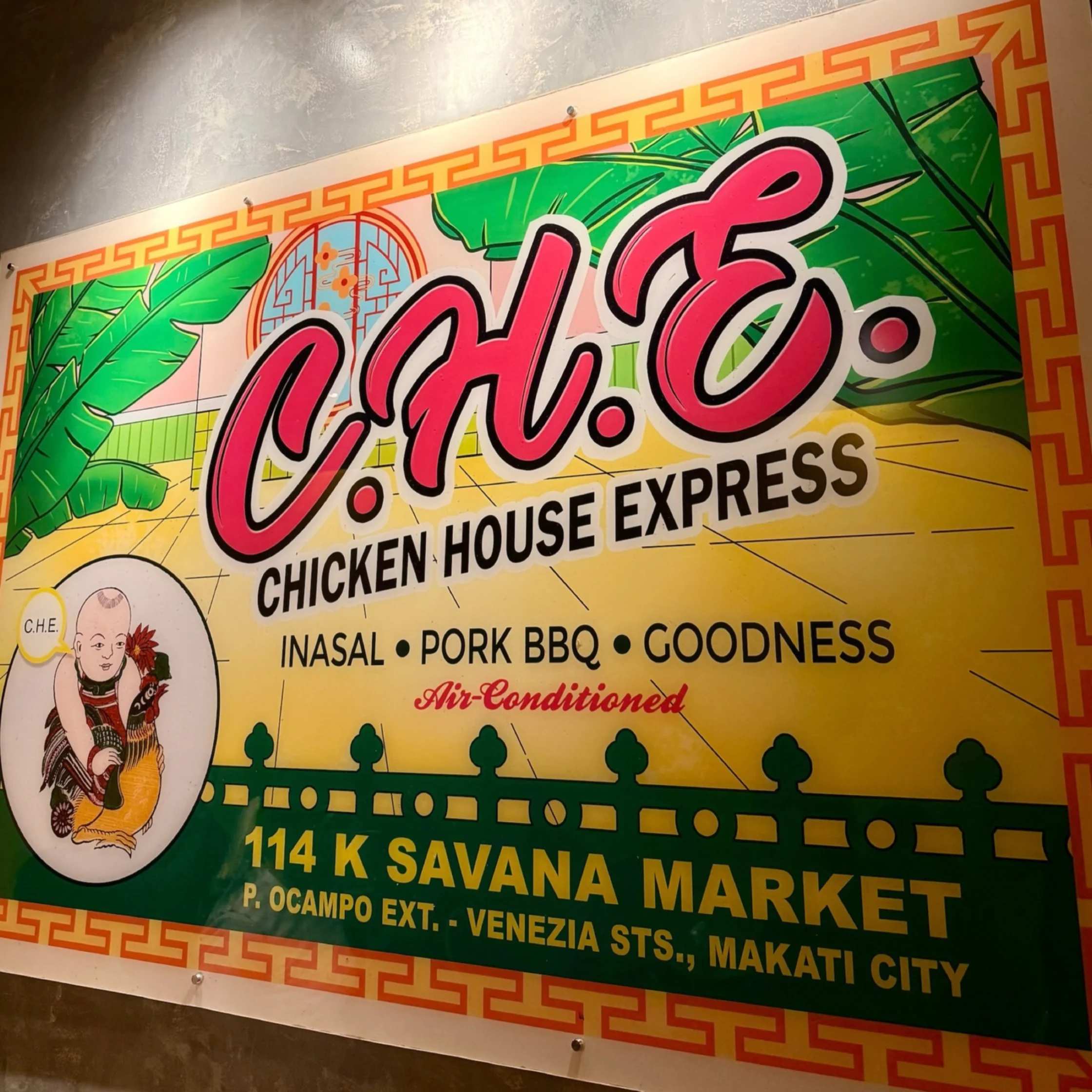 Colorful Chinese-style sign for C.H.E. Chicken House Express, advertising inasal, pork barbecue, and goodness at Savana Market in Makati. Its bold, festive design feels lively.