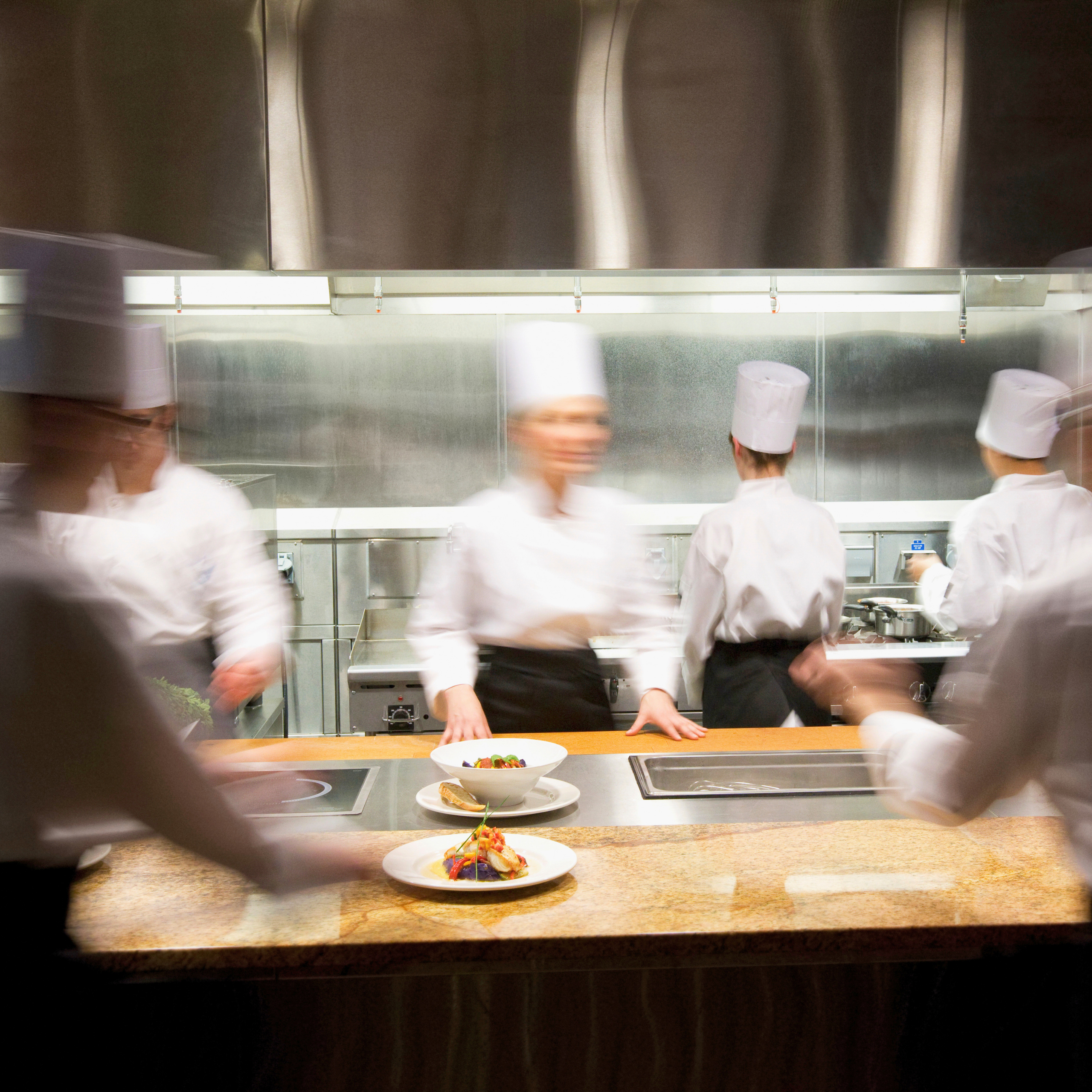 chefs in kitchen working